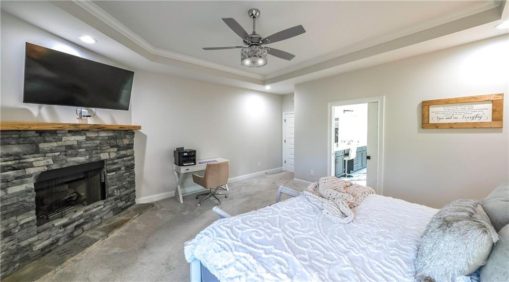 2392 Welcome Road Roopville, GA 30170 - Photo 65 of 65 a bedroom with a bed and a flat screen tv
