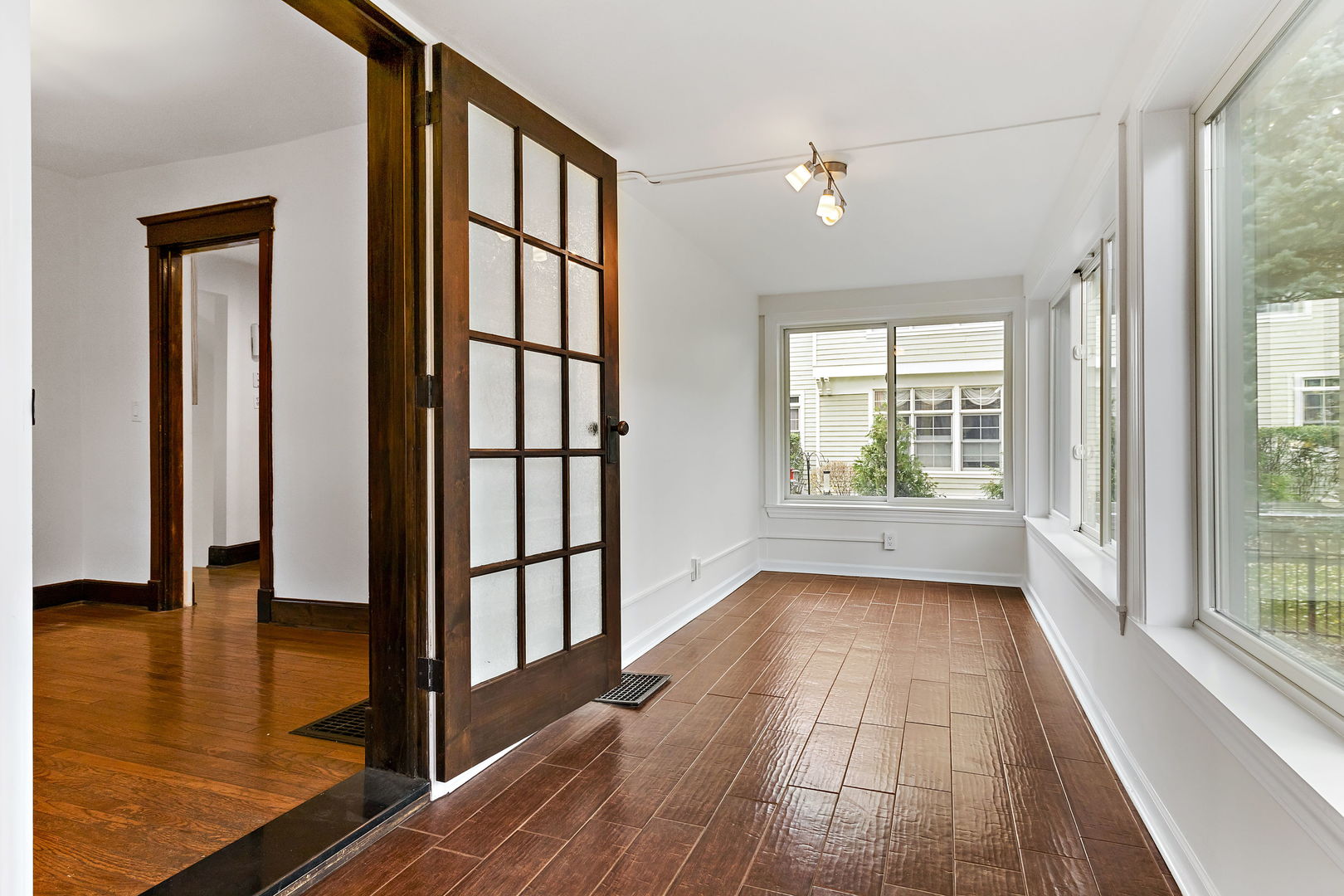 116 South West Street Naperville, IL 60540 - Photo 12 of 35 a view of an entryway with wooden floor and door