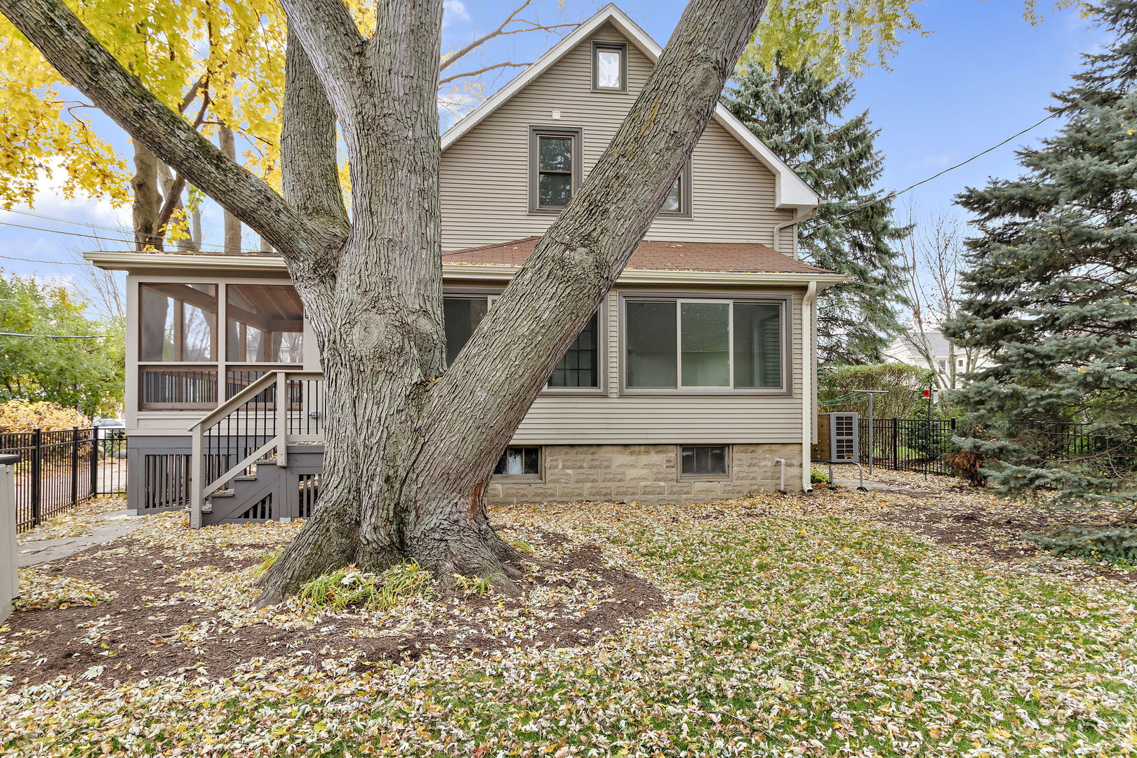 116 South West Street Naperville, IL 60540 - Photo 26 of 35 a house with tall trees in the background