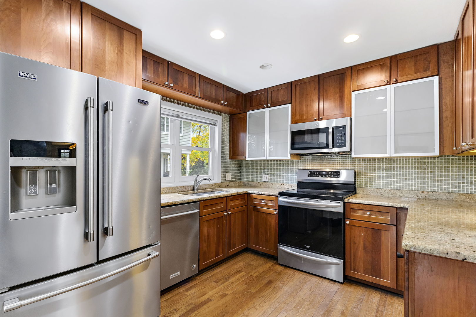 116 South West Street Naperville, IL 60540 - Photo 7 of 35 a kitchen with stainless steel appliances granite countertop a refrigerator a stove top oven a sink and dishwasher