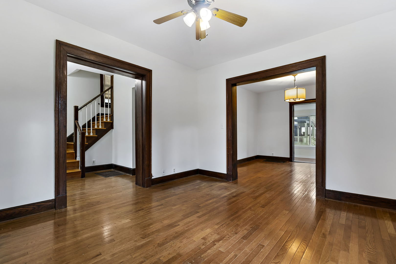 116 South West Street Naperville, IL 60540 - Photo 9 of 35 a view of an entryway with wooden floor and a chandelier