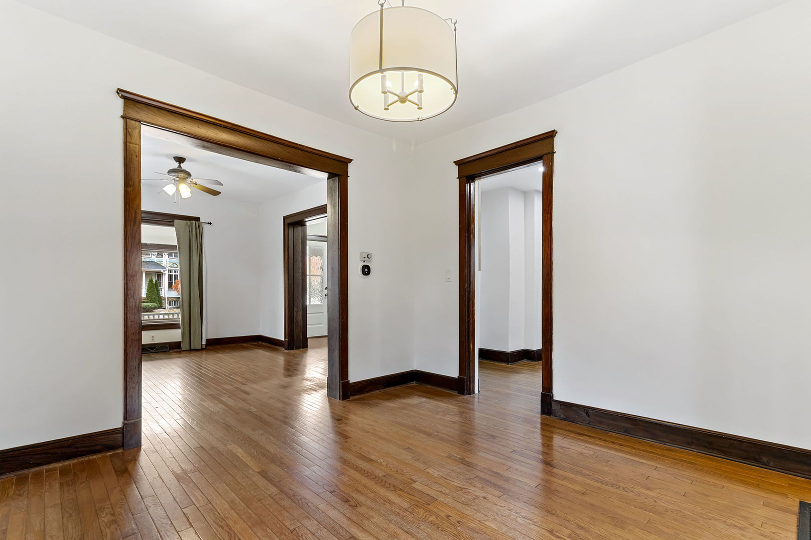 116 South West Street Naperville, IL 60540 - Photo 10 of 35 a view of a hallway with wooden floor and a window