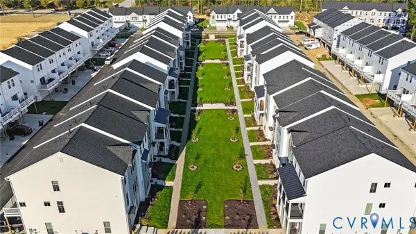 an aerial view of a house with a garden