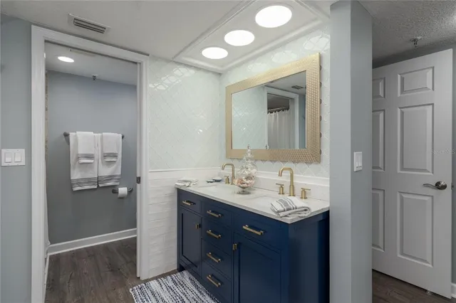 a bathroom with a sink and a mirror