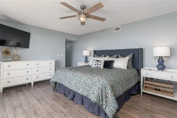 a bedroom with a bed and a dresser