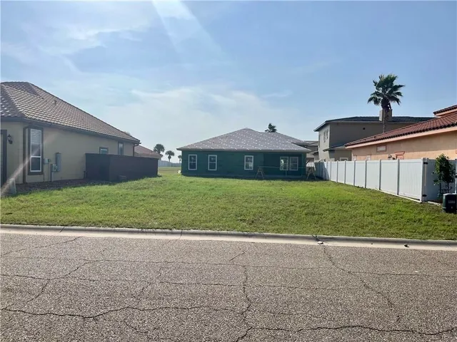a view of a house with a yard and plants