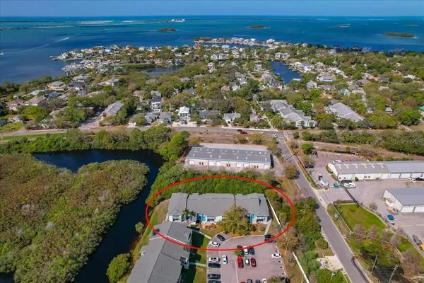 an aerial view of residential houses with outdoor space