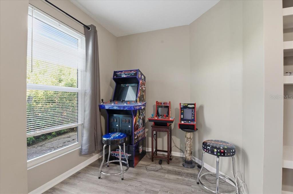 455 Alt 19, Unit 151 Palm Harbor, FL 34683 - Photo 15 of 52 a view of a workspace with furniture and a window