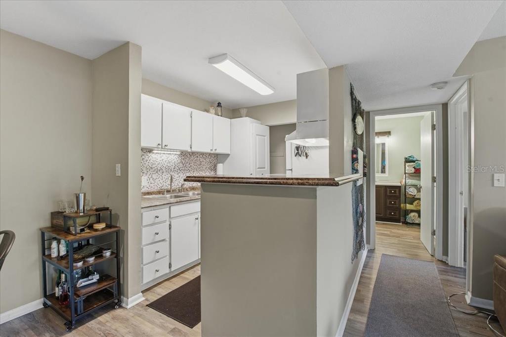 455 Alt 19, Unit 151 Palm Harbor, FL 34683 - Photo 18 of 52 a kitchen with stainless steel appliances a refrigerator sink and cabinets