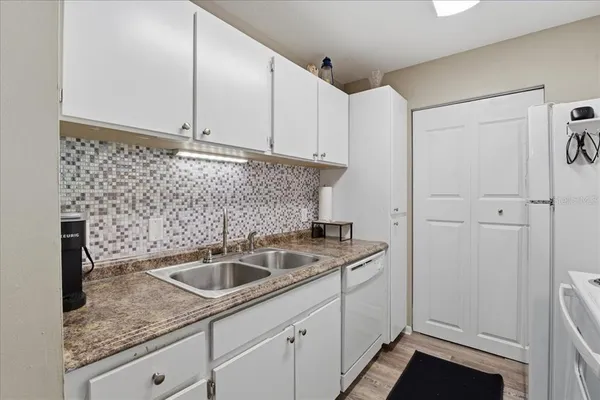 a bathroom with a sink toilet vanity and shower