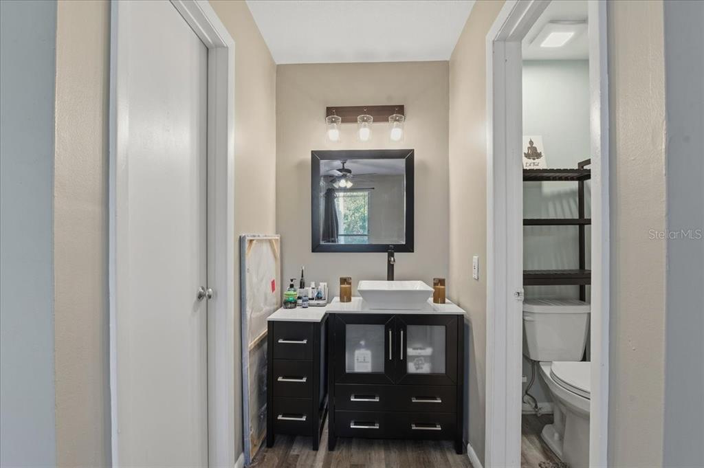 455 Alt 19, Unit 151 Palm Harbor, FL 34683 - Photo 25 of 52 a bathroom with a sink and a mirror