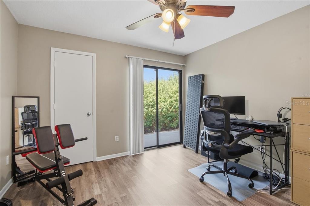 455 Alt 19, Unit 151 Palm Harbor, FL 34683 - Photo 28 of 52 a view of a workspace with furniture and a window