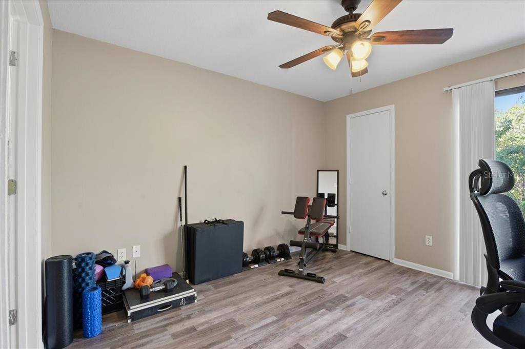 455 Alt 19, Unit 151 Palm Harbor, FL 34683 - Photo 29 of 52 a view of a workspace with furniture and gym equipment
