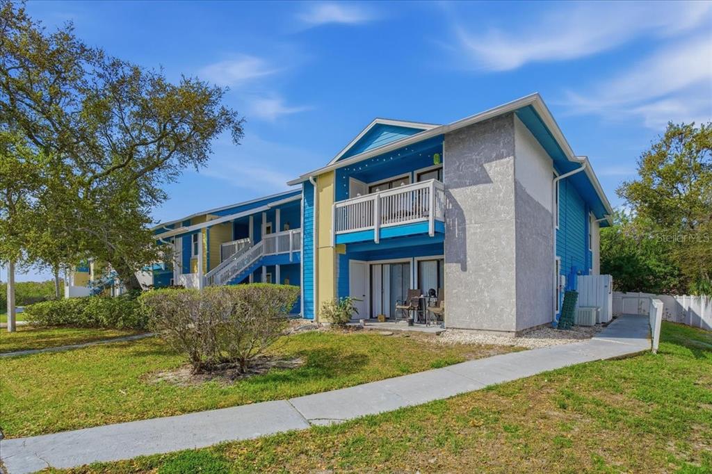 455 Alt 19, Unit 151 Palm Harbor, FL 34683 - Photo 35 of 52 a front view of a house with a yard
