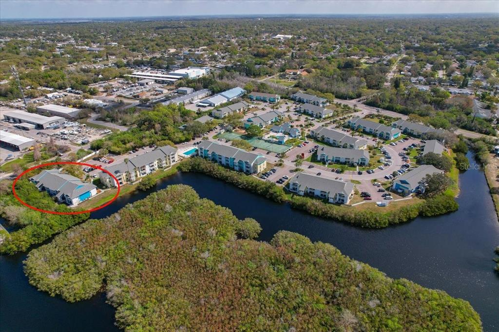 455 Alt 19, Unit 151 Palm Harbor, FL 34683 - Photo 44 of 52 an aerial view of residential houses with outdoor space