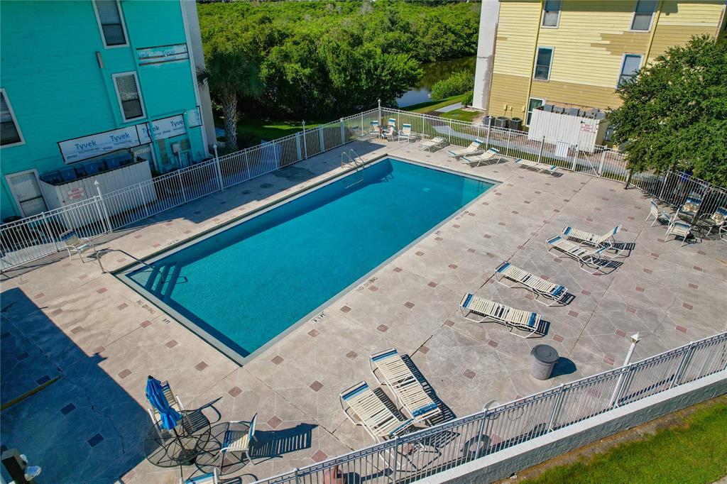 455 Alt 19, Unit 151 Palm Harbor, FL 34683 - Photo 51 of 52 a view of a pool with chairs