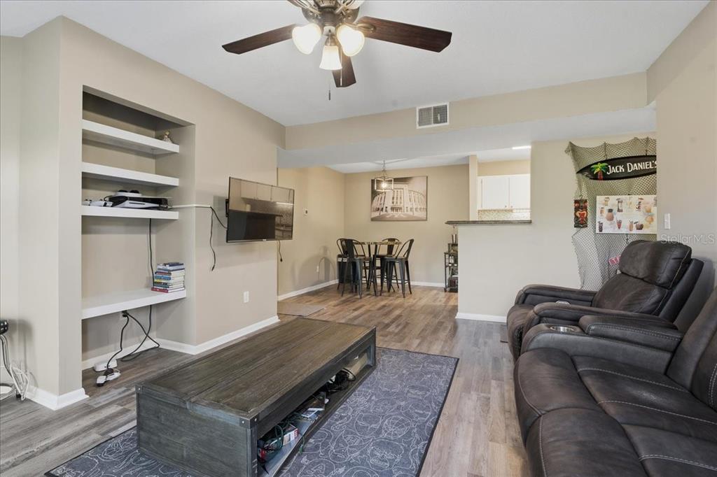 455 Alt 19, Unit 151 Palm Harbor, FL 34683 - Photo 7 of 52 a living room with furniture and a flat screen tv