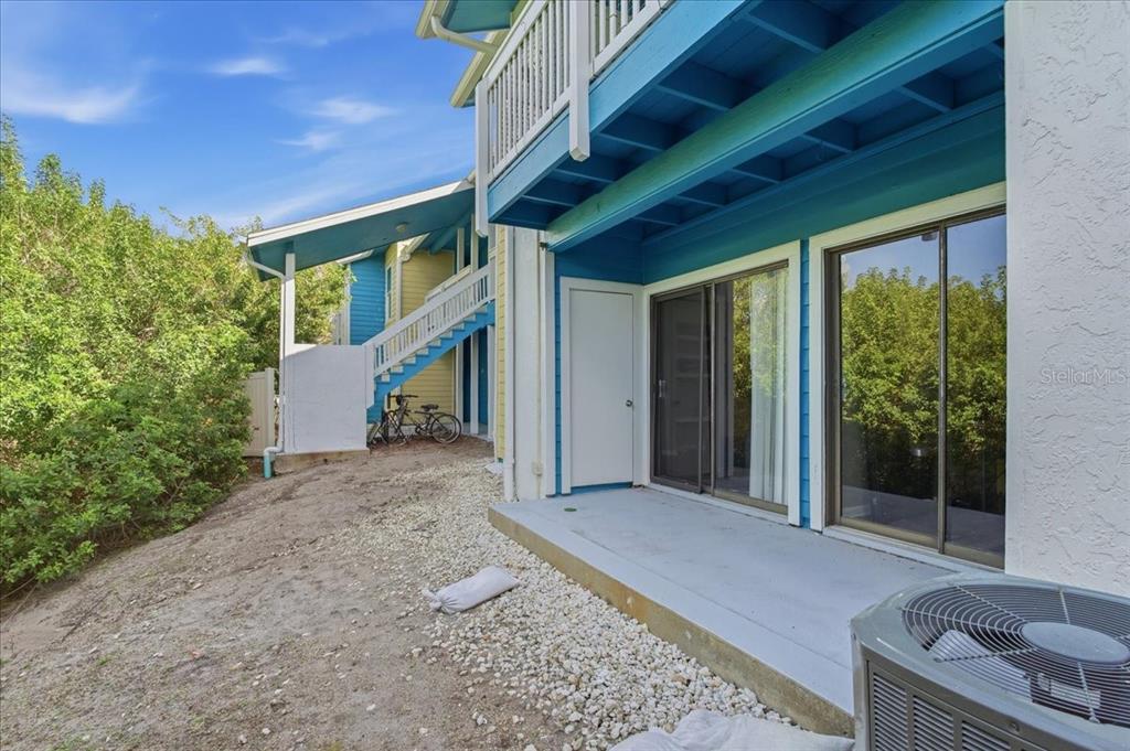 455 Alt 19, Unit 151 Palm Harbor, FL 34683 - Photo 9 of 52 a view of a porch with plants and trees