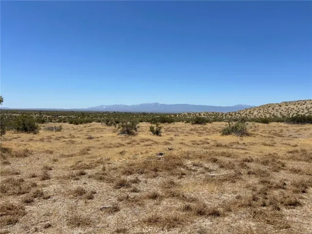 a view of mountain with sunset