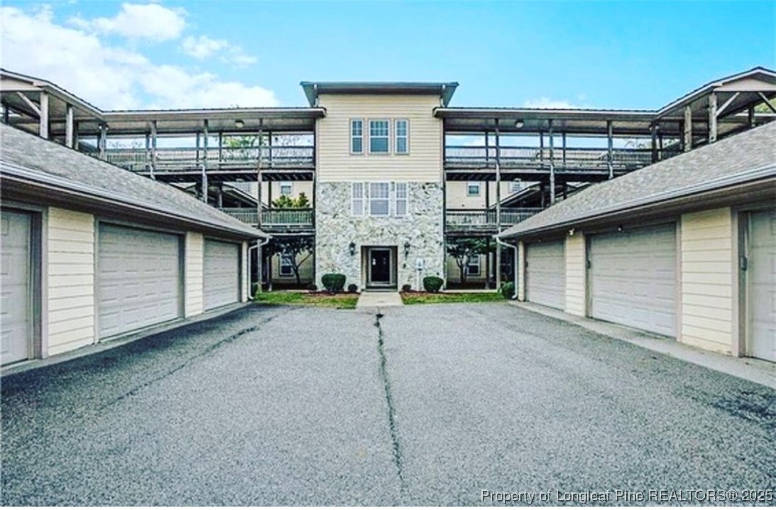 a view of a house with a street
