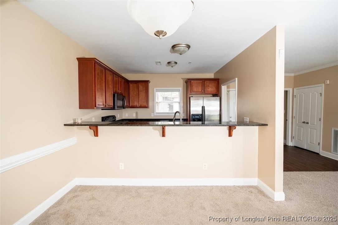 1611 Bluffside Drive, Unit 208 Fayetteville, NC 28312 - Photo 4 of 15 a view of kitchen with refrigerator and window