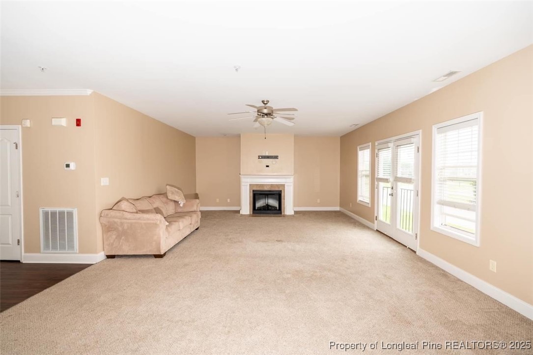 1611 Bluffside Drive, Unit 208 Fayetteville, NC 28312 - Photo 6 of 15 a living room with furniture window and fireplace