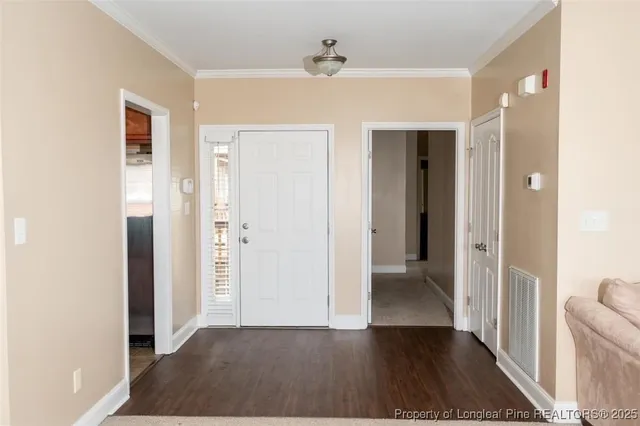wooden floor in a hall with an entryway