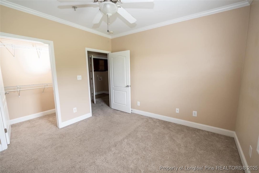 1611 Bluffside Drive, Unit 208 Fayetteville, NC 28312 - Photo 9 of 15 a view of an empty room with chandelier fan
