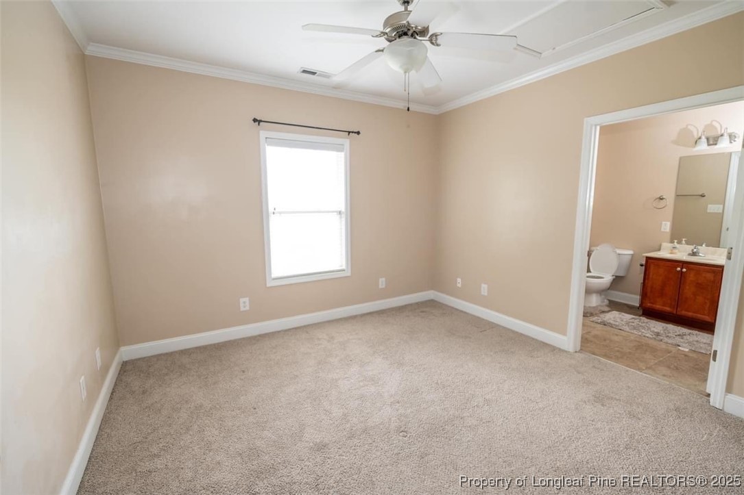 1611 Bluffside Drive, Unit 208 Fayetteville, NC 28312 - Photo 10 of 15 an empty room with chandelier fan and windows