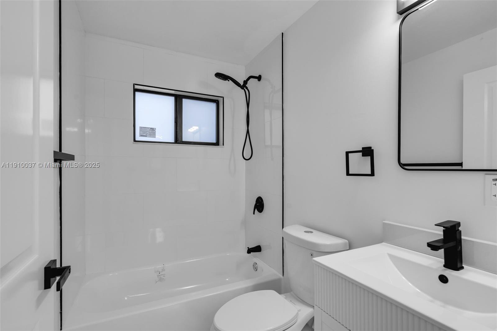 1411 Northwest 40th Street Miami, FL 33142 - Photo 14 of 52 a bathroom with a sink toilet and shower