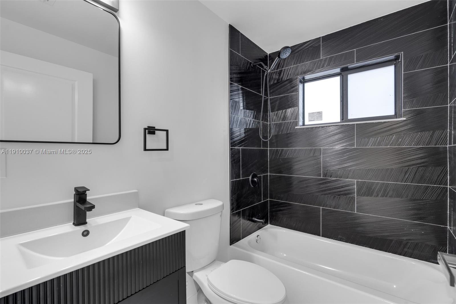 1411 Northwest 40th Street Miami, FL 33142 - Photo 20 of 52 a bathroom with a sink toilet and shower