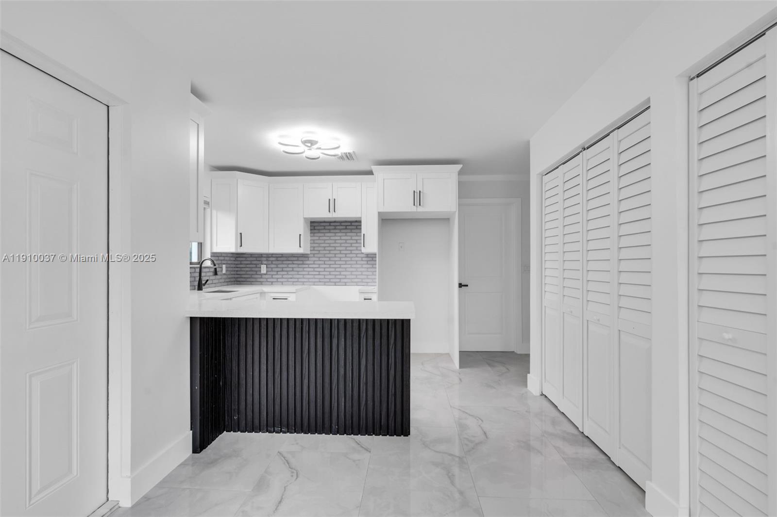 1411 Northwest 40th Street Miami, FL 33142 - Photo 28 of 52 a bathroom with a sink and a mirror