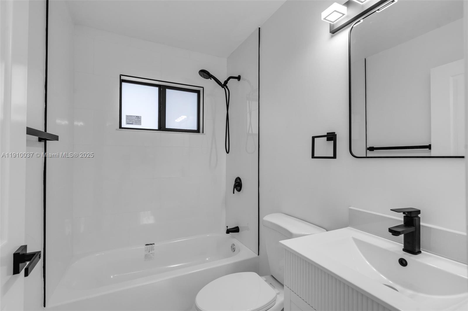 1411 Northwest 40th Street Miami, FL 33142 - Photo 35 of 52 a bathroom with a sink toilet and shower