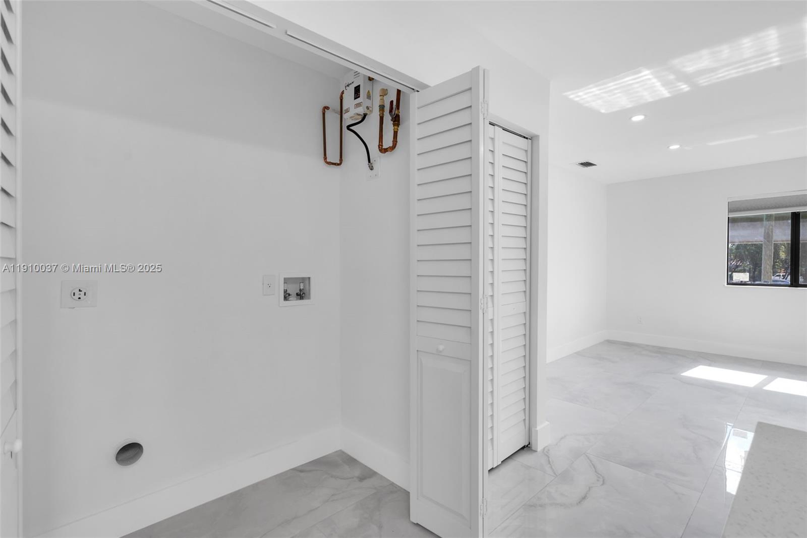 1411 Northwest 40th Street Miami, FL 33142 - Photo 40 of 52 a view of a hallway with closet