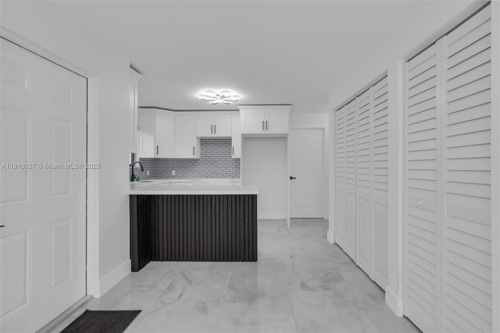 1411 Northwest 40th Street Miami, FL 33142 - Photo 9 of 52 a kitchen with a sink and cabinets