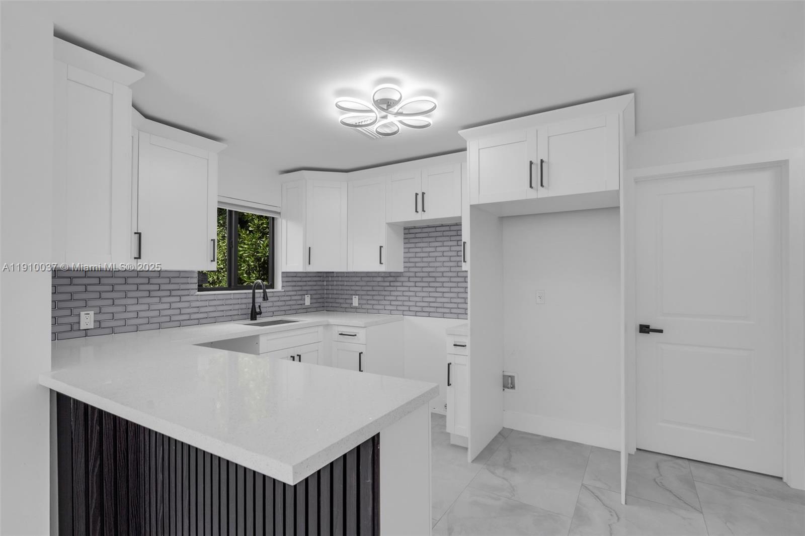 1411 Northwest 40th Street Miami, FL 33142 - Photo 10 of 52 a kitchen with a sink cabinets and window