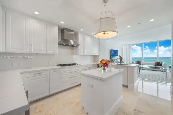a kitchen with a sink cabinets and window