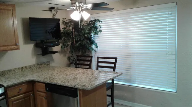 a kitchen with a table and chairs