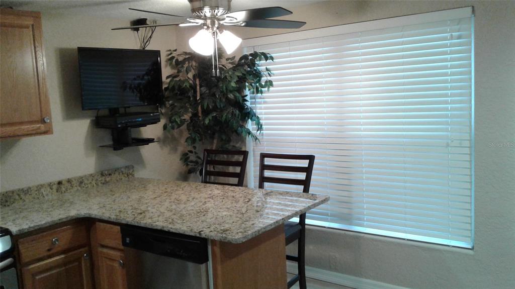 2512 Musselwhite Avenue, Unit 3 Orlando, FL 32804 - Photo 9 of 9 a kitchen with a table and chairs