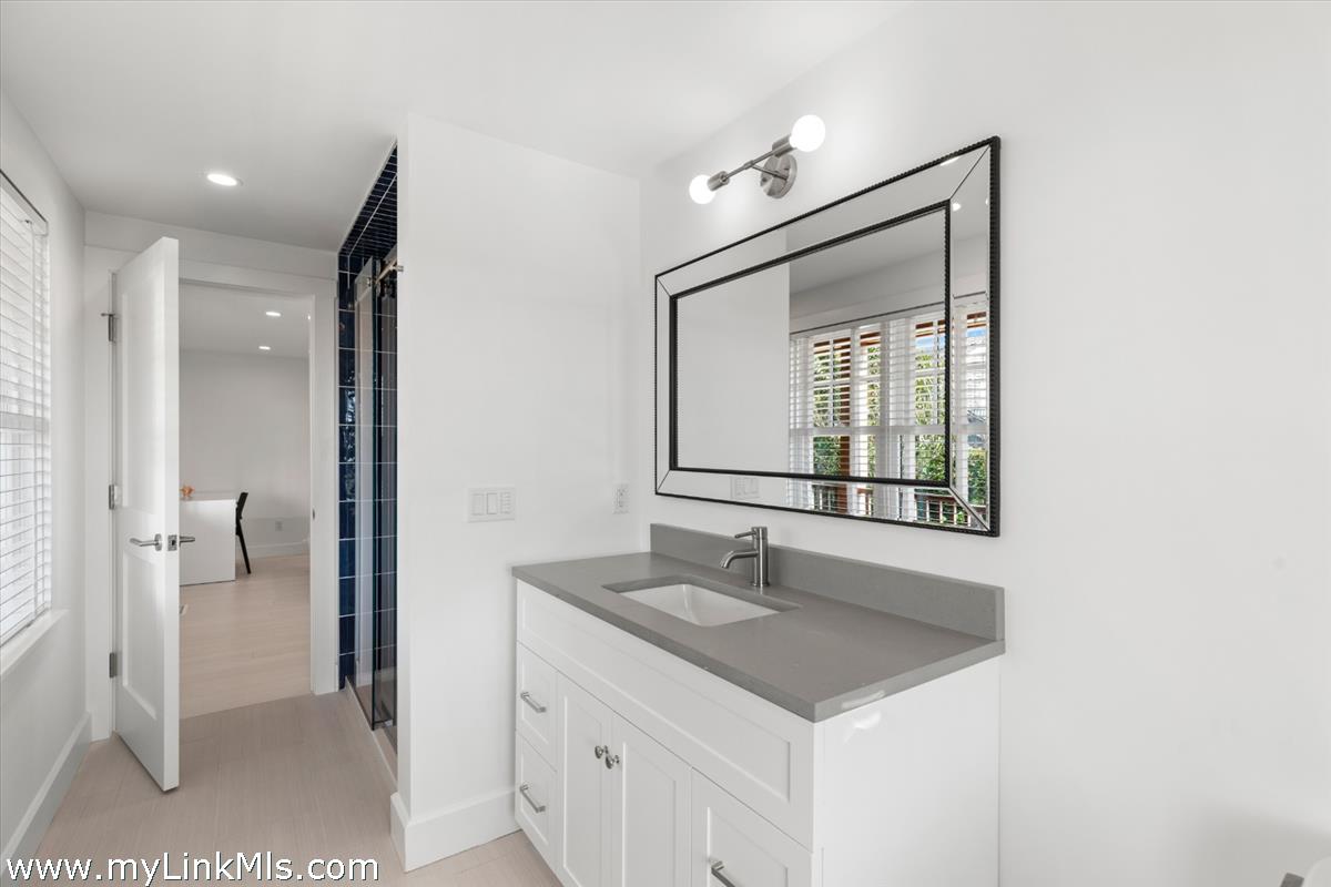 3 Tautemo Way Nantucket, MA 02554 - Photo 40 of 57 a bathroom with a sink and a mirror