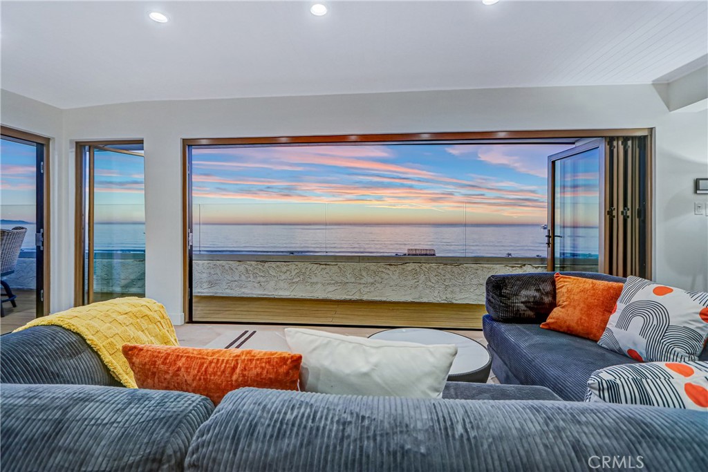 230 40th Street, Unit 3 Manhattan Beach, CA 90266 - Photo 21 of 38 a living room with furniture and a large window