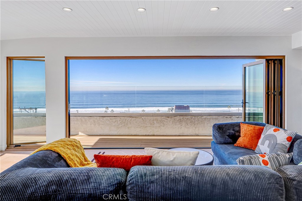 230 40th Street, Unit 3 Manhattan Beach, CA 90266 - Photo 5 of 38 a living room with furniture and a window