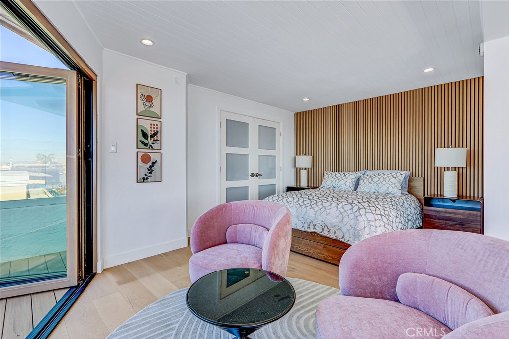 230 40th Street, Unit 3 Manhattan Beach, CA 90266 - Photo 8 of 38 a bedroom with furniture and a large window