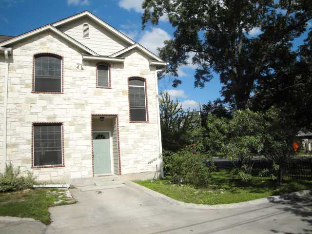 600 Kawnee Drive, Unit D Austin, TX 78752 - Photo 1 of 1 a front view of a house with a yard