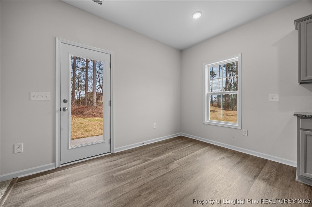96 Regis Lane Coats, NC 27521 - Photo 11 of 36 an empty room with windows and closet