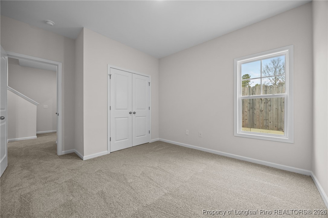96 Regis Lane Coats, NC 27521 - Photo 13 of 36 an empty room with windows