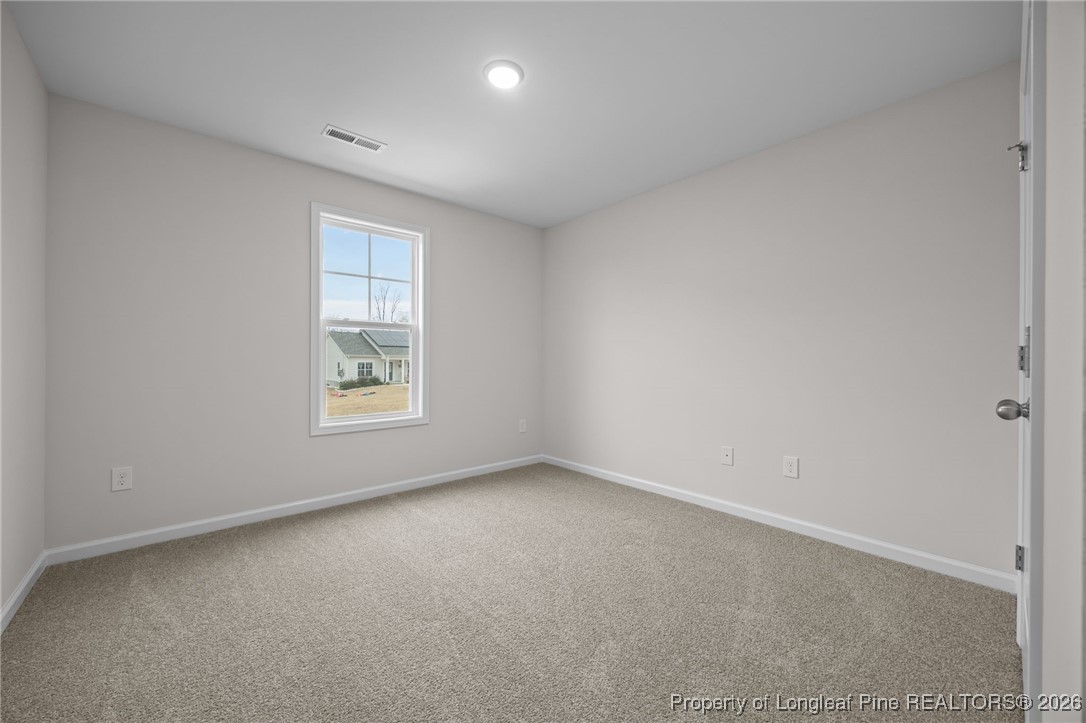 96 Regis Lane Coats, NC 27521 - Photo 15 of 36 an empty room with a window