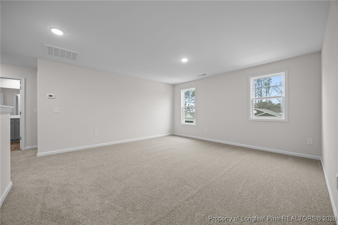 96 Regis Lane Coats, NC 27521 - Photo 18 of 36 an empty room with windows