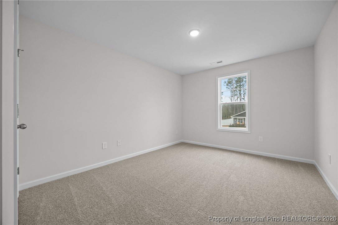 96 Regis Lane Coats, NC 27521 - Photo 20 of 36 an empty room with windows