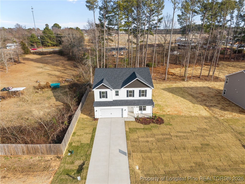 96 Regis Lane Coats, NC 27521 - Photo 2 of 36 a front view of a house with a yard